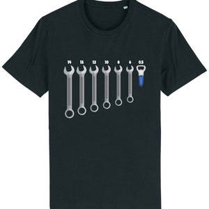 May include: A black t-shirt featuring a graphic of wrenches in various sizes, labelled with their measurements, and a bottle opener labelled "0.5".