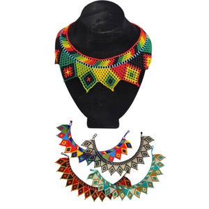 May include: A colourful beaded necklace in red, yellow, green, and black is displayed on a black mannequin bust. Below, four additional beaded necklaces in various colour combinations are shown, including red, blue, and turquoise.