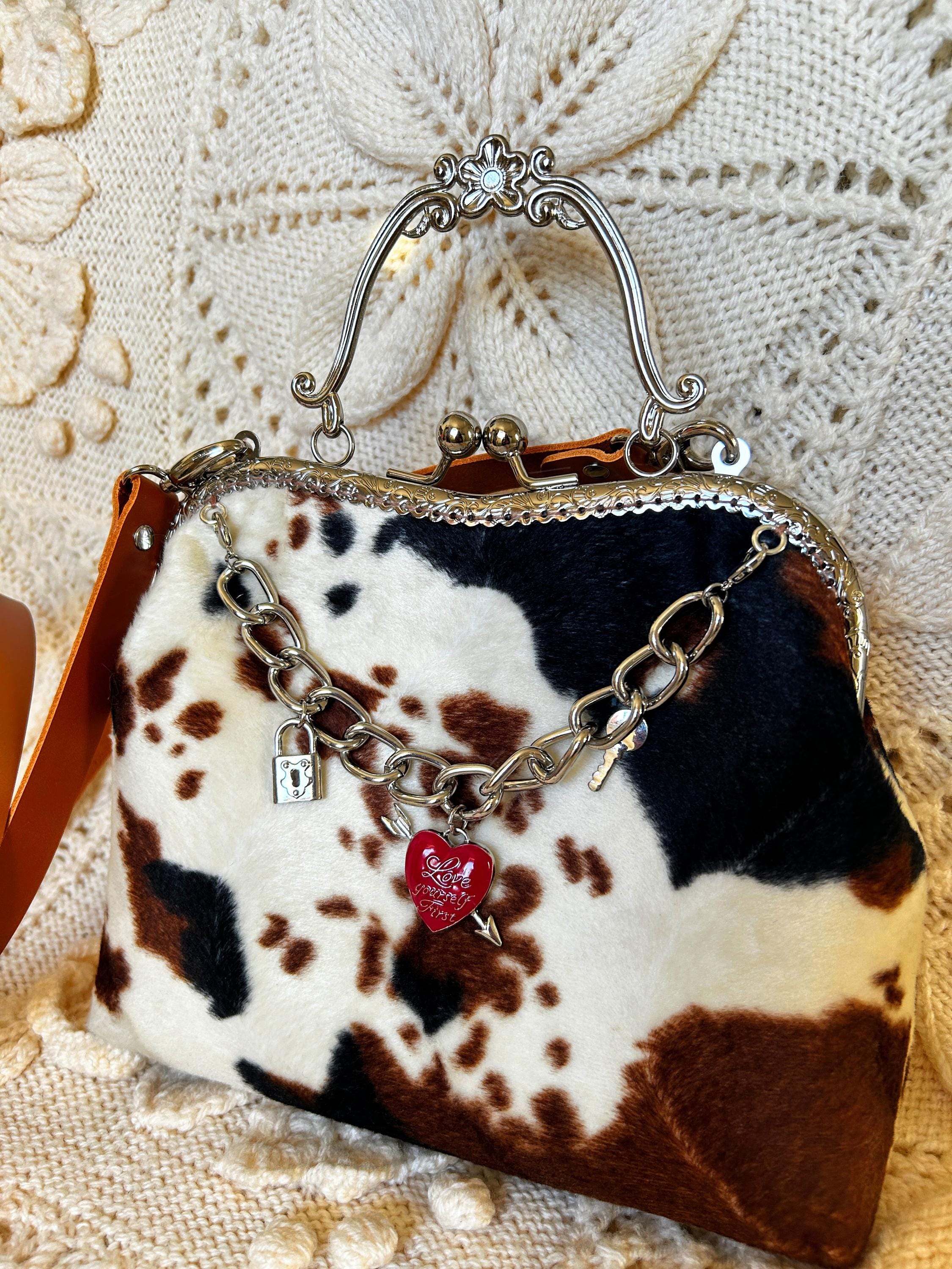 Faux Fur Cow Print Clutch Bag With Kiss Clasp Frame, Leather Strap