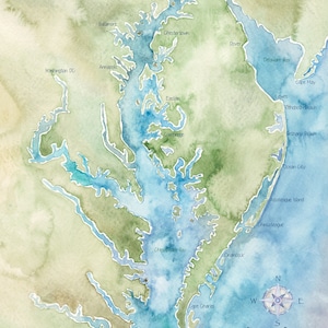May include: Watercolor map of Chesapeake Bay, featuring cities like Annapolis, Baltimore, and Washington DC. The map uses blue, green, and tan hues, with a compass rose and the bay's name in cursive script. Coordinates are also included.