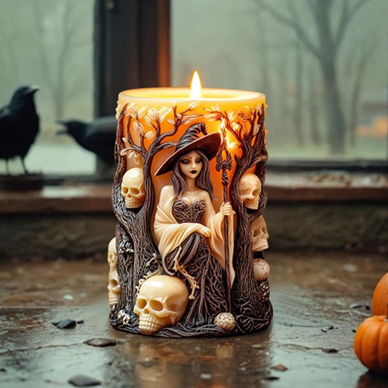 May include: A candle with a witch figure and skulls sculpted into the wax. The witch is wearing a black dress and a pointed hat. The candle is lit and the flame is casting a warm glow.