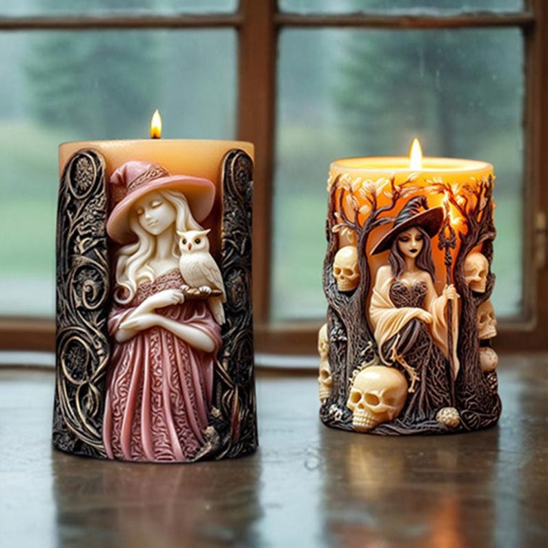 May include: Two decorative pillar candles with a Halloween theme. One candle features a witch holding an owl, while the other candle features a witch holding a staff with skulls and branches surrounding her.