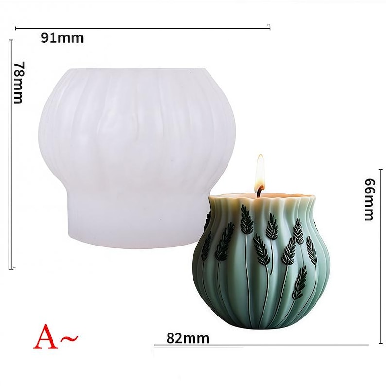 May include: A white, ribbed silicone mold and a lit green candle. The candle is 66mm tall and 82mm wide, with a design of dark green wheat stalks. The mold is 78mm tall and 91mm wide. The candle has a wavy rim.