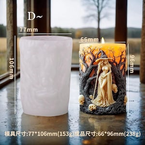 May include: A white candle holder with a black and orange candle inside. The candle features a witch with a staff and a skull. The candle is 6.6 inches tall and 3.8 inches wide. The candle holder is 7.7 inches tall and 4.2 inches wide.