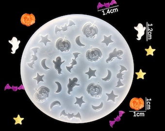 May include: A clear silicone mold with 18 different Halloween-themed shapes, including bats, ghosts, pumpkins, and moons. The mold measures 1.4 inches in diameter and 1.2 inches in height. The mold is shown with small orange and yellow pumpkin-shaped decorations, white ghost-shaped decorations, purple bat-shaped decorations, and yellow star-shaped decorations.