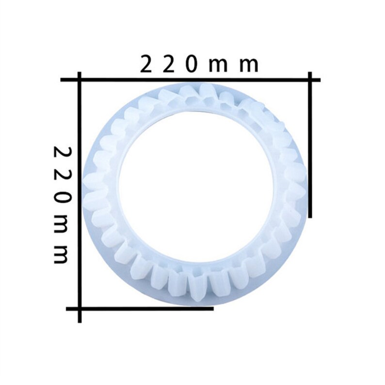 May include: A white plastic ring with a diameter of 220 mm. The ring has a scalloped edge.