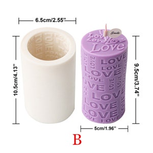 May include: A white silicone candle mold with a diameter of 6.5 inches and a height of 10.5 inches. The mold is next to a purple candle with the word "Love" repeated on the side. The candle is 5 inches in diameter and 9.5 inches tall.