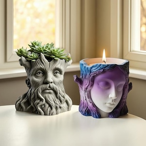 Könnte beinhalten: Zwei dekorative Artikel: ein grauer Baummann-Pflanztopf mit grünen Sukkulenten und ein Kerzenhalter mit einem Frauengesicht, mit lila und blauen Akzenten. Der Kerzenhalter hat eine brennende gelbe Flamme.