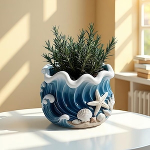 May include: A blue ceramic planter with a wave design, white starfish, and seashells. The planter holds a green plant. The planter is on a white surface. The planter is approximately 8 inches in diameter.