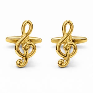 Könnte beinhalten: Ein Paar goldfarbene Manschettenknöpfe, jeweils mit einem Notenschlüssel-Design. Die Manschettenknöpfe haben eine polierte Oberfläche und einen klassischen, eleganten Stil, für Musiker oder Musikliebhaber.