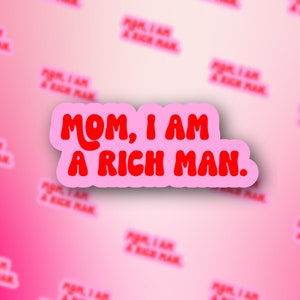 May include: Pink sticker with the text "MOM, I AM A RICH MAN." in red, bubble letters.