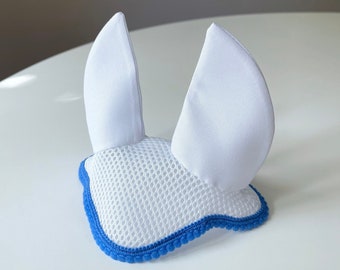 May include: White horse fly bonnet with blue trim. The bonnet has a mesh fabric and two large ear covers.