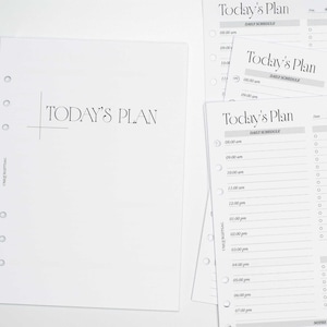 May include: White planner inserts featuring the text "Today's Plan". The inserts have a minimalist design and include daily schedule templates with time slots from 8:00 am to 7:00 pm, ideal for organizing daily tasks and appointments.