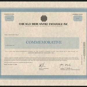 May include: A commemorative stock certificate for the Chicago Mercantile Exchange Inc., dated November 13, 2000. The certificate is printed on a cream-colored paper with blue borders and features the company's logo and the signatures of Scott Gordon, Chairman, and James J. McNulty, President and Chief Executive Officer.