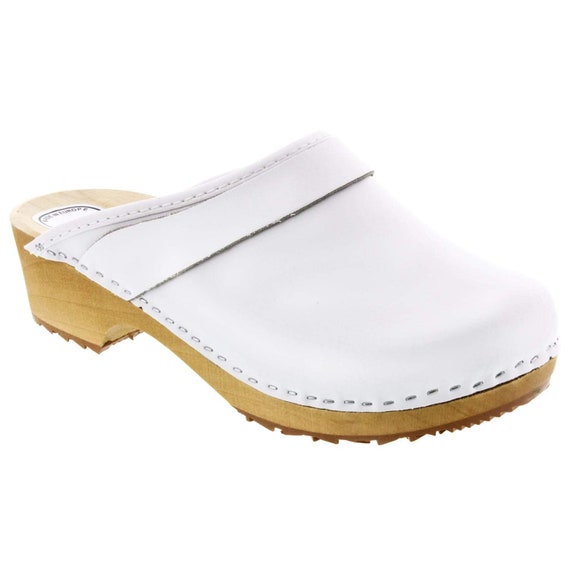 white wooden clogs