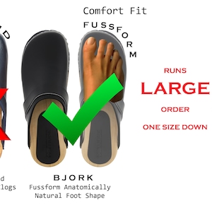May include: Two pairs of clogs, one with a rounded toe and one with a more natural foot shape. The text "Comfort Fit" and "Runs Large, Order One Size Down" is displayed next to the clogs.