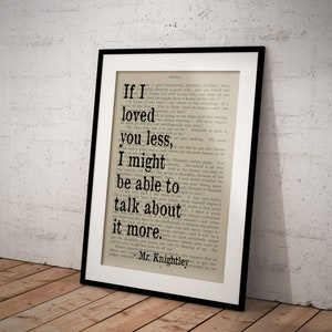 May include: A framed print of a vintage book page with a quote from the novel "Emma" by Jane Austen. The quote reads: "If I loved you less, I might be able to talk about it more."