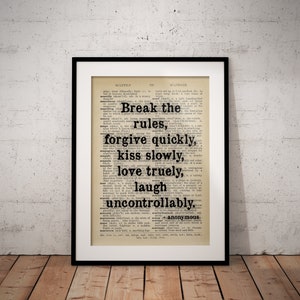 May include: A framed print with a black border, displaying text on a vintage dictionary page. The quote reads: "Break the rules, forgive quickly, kiss slowly, love truly, laugh uncontrollably, anonymous."
