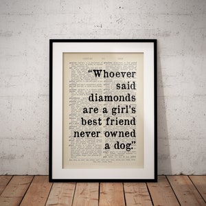 May include: A black framed print with a white background and black text. The text reads "Whoever said diamonds are a girl's best friend never owned a dog."