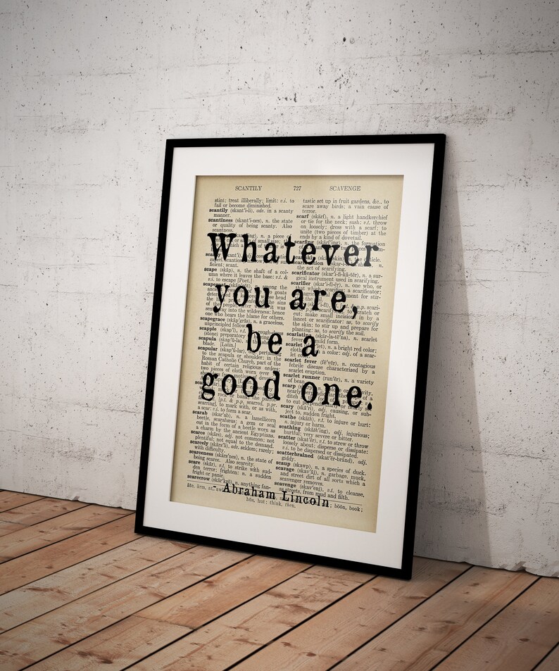 May include: A framed print of a dictionary page with the quote "Whatever you are, be a good one." attributed to Abraham Lincoln.