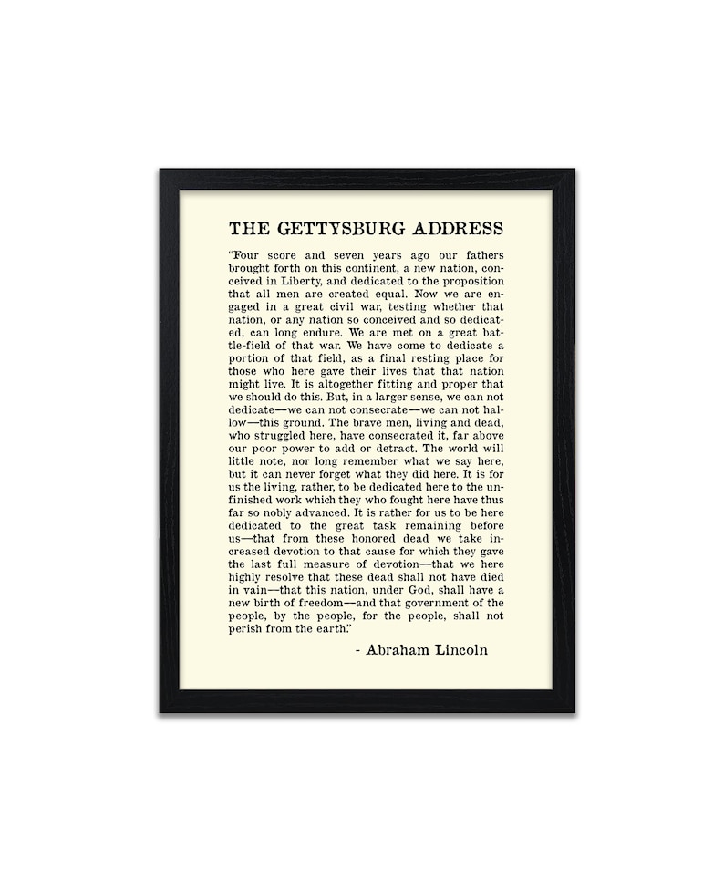 May include: A black and white print of the Gettysburg Address by Abraham Lincoln. The text is framed in a black frame with a white mount.