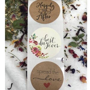 May include: Three round brown and white stickers with wedding-themed text. The top sticker says "Happily Ever After" in black script. The middle sticker has a floral design and says "Best Day Ever" in black script. The bottom sticker says "Spread the Love" in black script with a red heart.