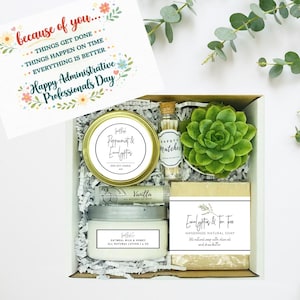 May include: A gift box with a card that reads "Happy Administrative Professionals Day." The box contains a candle, lotion, soap, matches, a succulent, and a lip balm. The candle is labeled "Peppermint & Eucalyptus."
