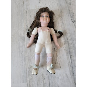 Victoria Impex Corp porcelain doll wind up girl music collectible