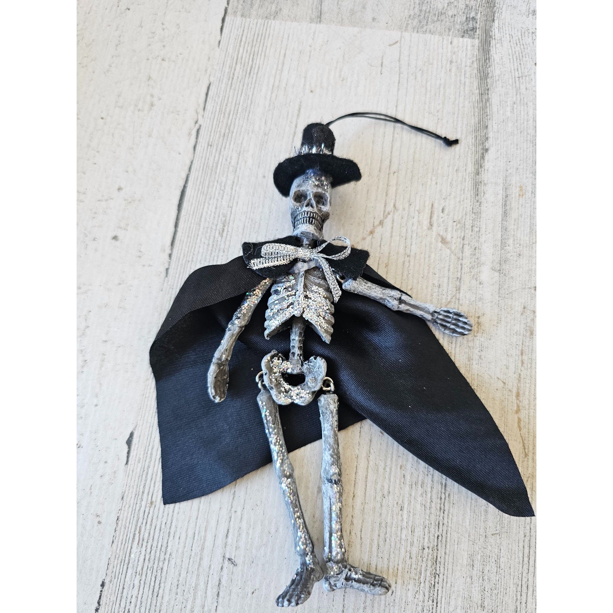 skeleton dressed in a winter hat Jointed Glitter Ornament Unique Decor Halloween Silver Cape Top NOVA | Women's Lace collection:prom Color:Periwinkle blue