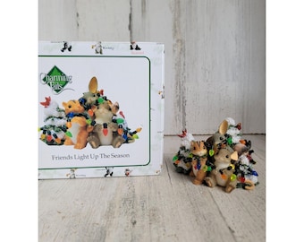 Encantadores amigos de colas iluminan la temporada navideña figura ardilla ratón