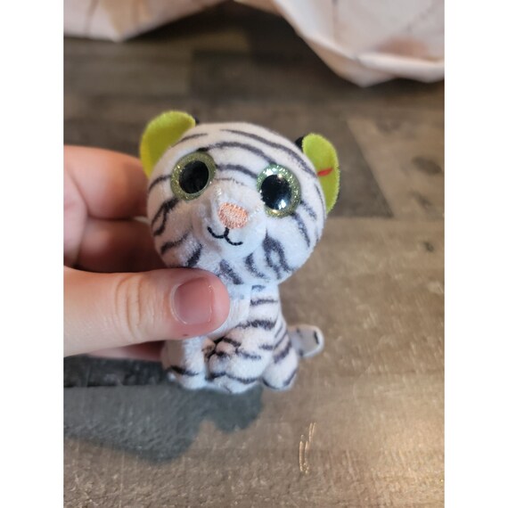 green stuffed tiger