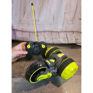 Playtek black lime green remote control car bike toy figure