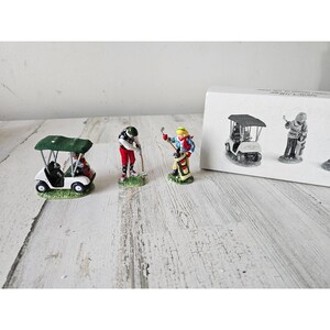 Dept 56 54939 pierwszy okrągły rok wózek golfowy zabytkowy śnieg wioska ludzie akcesoria
