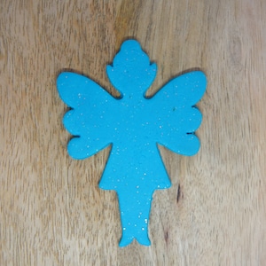 May include: A blue glitter angel ornament with a simple design. The ornament is made of a lightweight material and has a flat back.