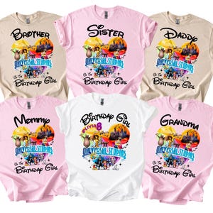 May include: Six short-sleeved t-shirts in shades of tan, pink, and white. Each shirt displays a graphic design with the text "Brother," "Sister," "Daddy," "Mommy," "Birthday Girl," and "Grandma," along with a Universal Studios theme.