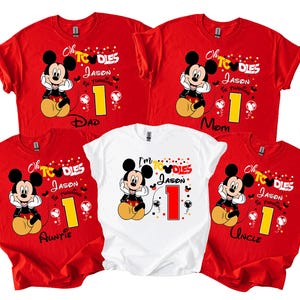 May include: Red and white t-shirts with a Mickey Mouse graphic. The shirts feature the text "Oh Toodles" and "I'm Toodles" with the name "Jason" and the number "1". The shirts are for Dad, Mom, Auntie, and Uncle.
