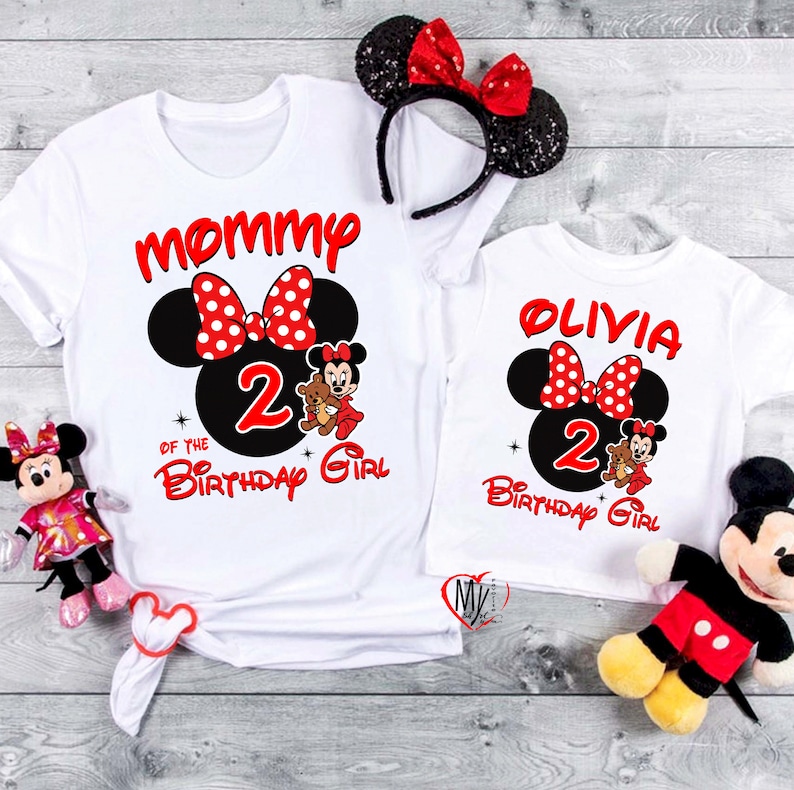 May include: Two white t-shirts with a red and black Mickey Mouse design. The larger shirt says "Mommy of the 2nd Birthday Girl" and the smaller shirt says "Olivia 2nd Birthday Girl".