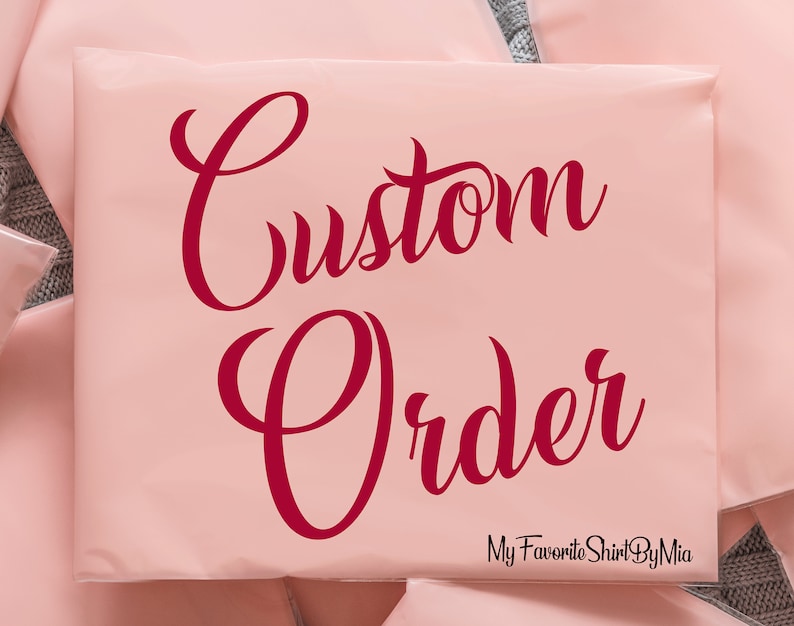 May include: A pink mailing envelope with the text "Custom Order" in red cursive lettering. The text "My Favorite Shirt By Mia" is printed in black at the bottom of the envelope.