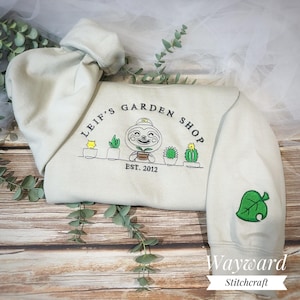 Leif’s Garden Shop Embroidered Sweatshirt ~ ACNH Inspired Gamer Gift Jumper ~ Item Leaf Game Embroidered Sleeve Detail! Unisex Sweater!