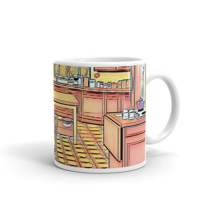 May include: A white ceramic mug with a colorful comic book style illustration of a kitchen interior. The illustration features a counter with cabinets, a table, and a tiled floor.