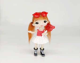 Doll with red hair in short white skirt and pink t-shirt teenage dirl amigurumi with candy and red glasses for dollhouse