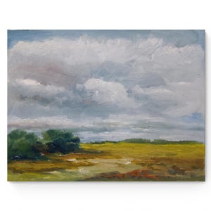 May include: Oil painting depicting a landscape with a cloudy sky. The artwork shows a field of yellow and brown tones, with green trees on the left. The sky is filled with white and grey clouds, creating a tranquil atmosphere.