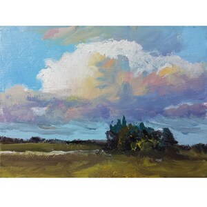 May include: An oil painting on canvas depicting a landscape with a large, textured white and pink cloud formation dominating a bright blue sky. Below, a dark green cluster of trees sits amidst a field of muted yellow, brown, and olive green tones.