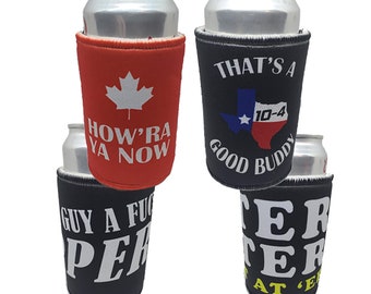 May include: Four different can coolers with various designs. The first cooler is red with a Canadian maple leaf and the text "How'ra Ya Now". The second cooler is black with a Texas flag and the text "That's a Good Buddy 10-4". The third cooler is black with white text that says "Guy a Fuc Per". The fourth cooler is black with white text that says "Ter Ter At E".