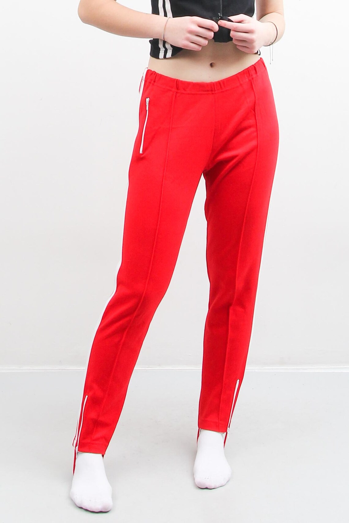 red and white jogging pants