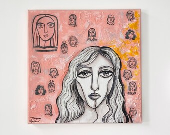 May include: A pink canvas painting with a central image of a woman with long black hair and a white face. The woman's face is drawn in a stylized manner with thick black lines. The background is filled with smaller images of women's faces, all drawn in the same style. The painting is signed "Megan Rose" in the bottom left corner.