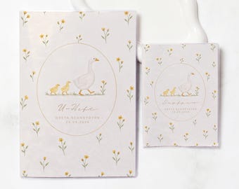May include: A light gray booklet and a smaller matching card, both featuring a repeating pattern of small yellow flowers. Each item displays a circular frame containing an illustration of a white goose with two goslings, the text U-Heft, Greta Schneydyrn, and 24.09.2026.