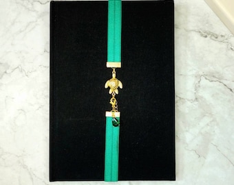 Bookmark,adjustable, green and gold.