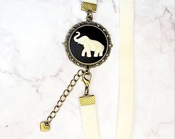 Bookmark, adjustable, velvet ivory elastic, elephant cameo.