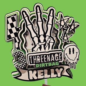 May include: A layered cake topper featuring a skeleton hand making a peace sign, a checkered number three, stars, and a melting smiley face. The text reads THREENAGE DIRT BAG and KELLY. The design uses black, white, and green colors with a clear stick.